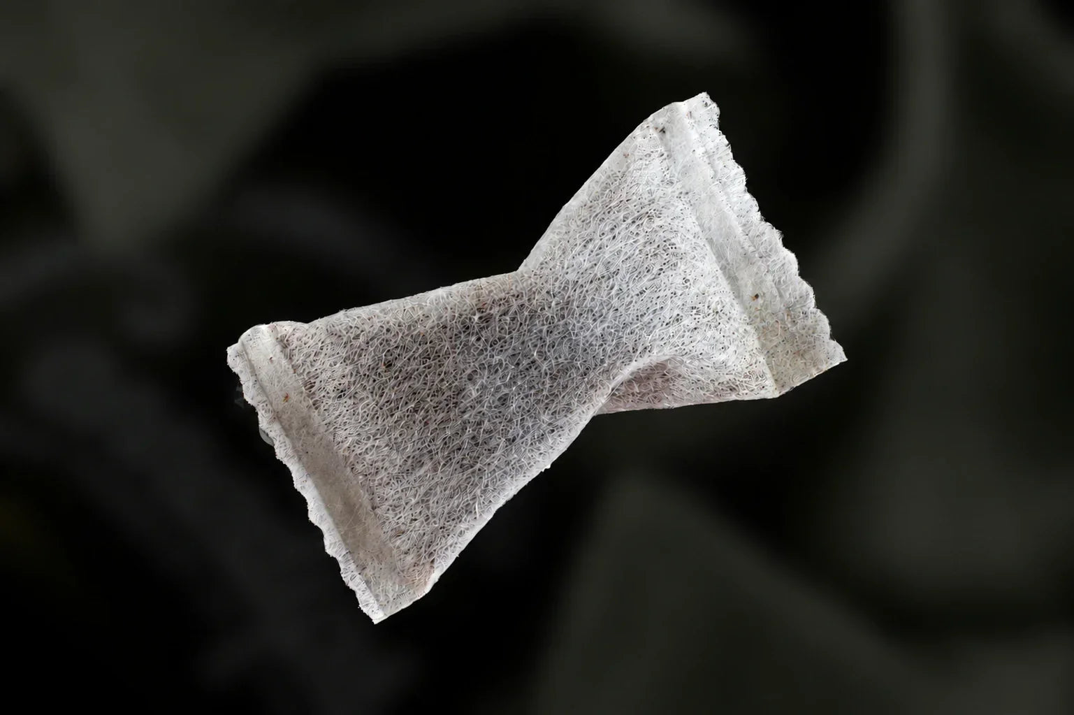 Nicotine pouch on black background