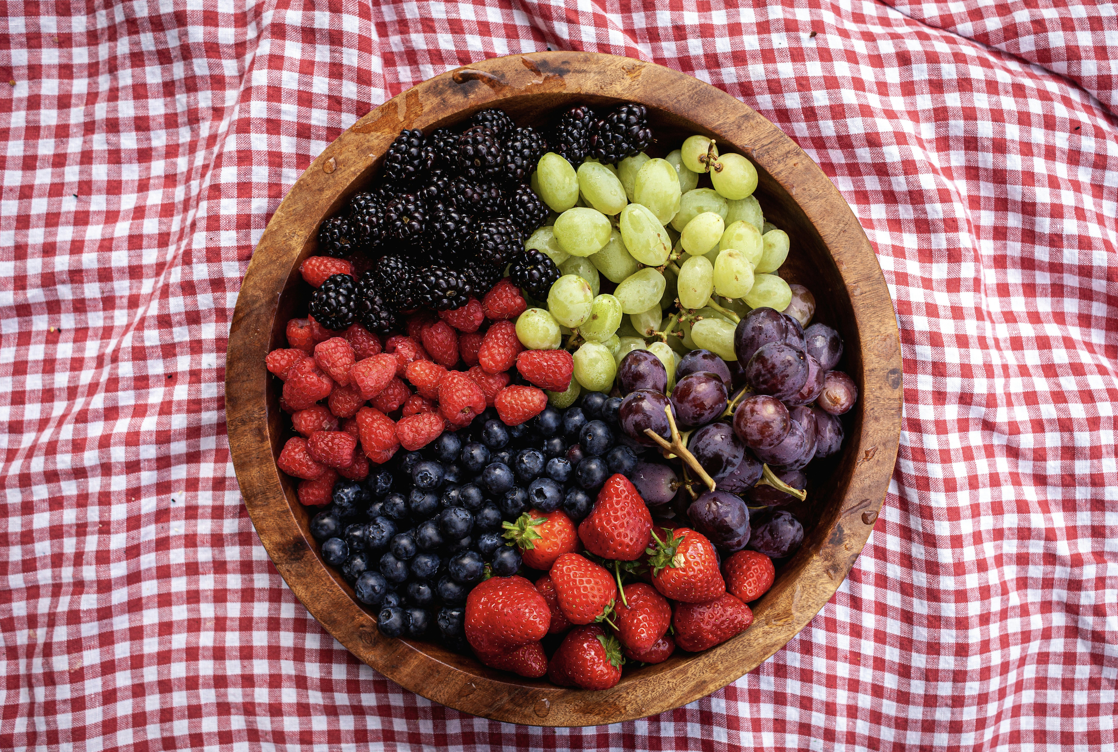 fruit bowl on a red gingham table cloth